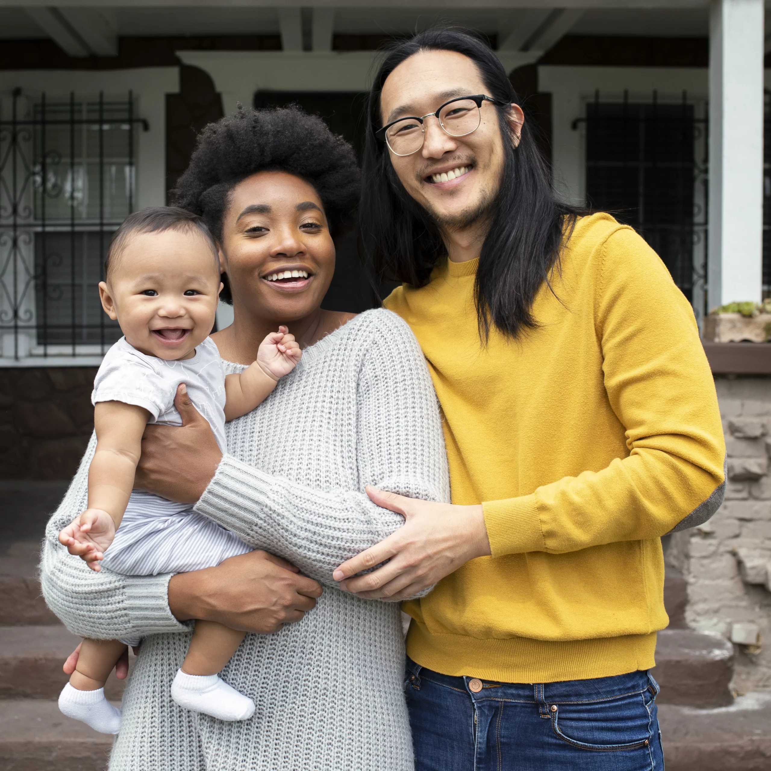 beautiful-multiethnic-family-standing-porch-during-covid19-lockdown
