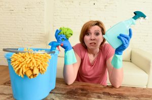 Woman holding cleaning chemicals